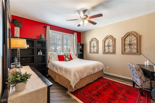 bedroom with ceiling fan and dark hardwood / wood-style flooring