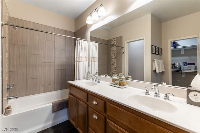 bathroom featuring vanity and shower / bathtub combination with curtain