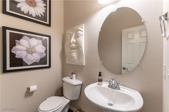 bathroom with toilet and sink