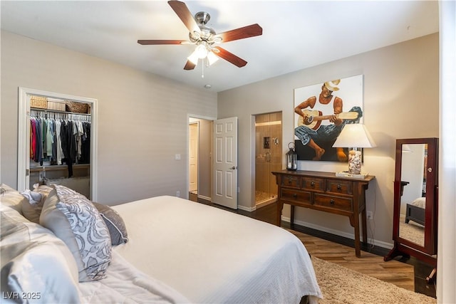 bedroom featuring ceiling fan, dark wood-type flooring, and a closet