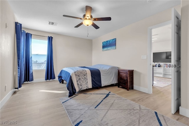 bedroom featuring ceiling fan and light hardwood / wood-style flooring