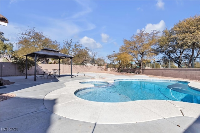 view of pool featuring a gazebo, a patio, and an in ground hot tub