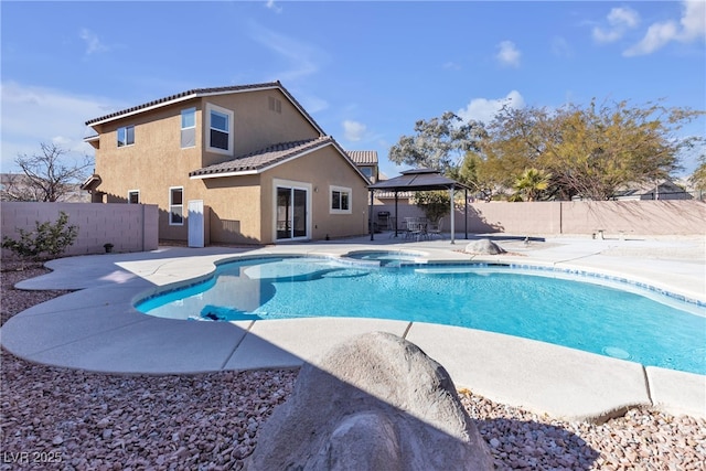 view of swimming pool featuring a gazebo, a patio area, and an in ground hot tub