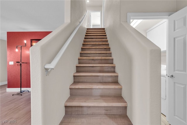 staircase featuring hardwood / wood-style floors