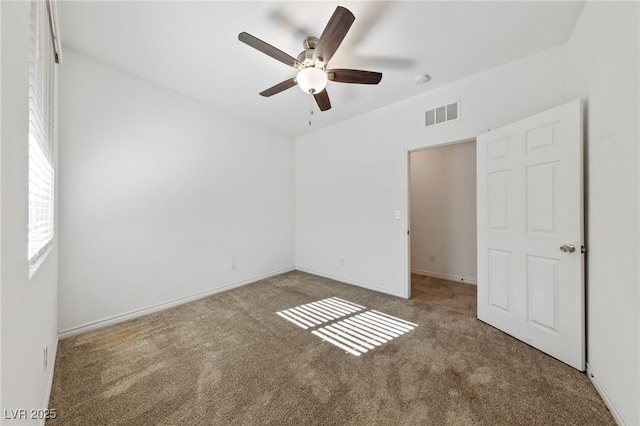 unfurnished bedroom with ceiling fan and carpet flooring