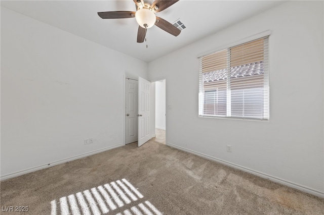 carpeted empty room featuring ceiling fan