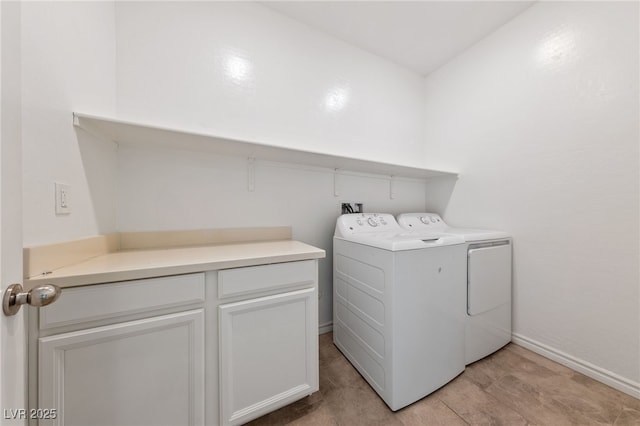 clothes washing area featuring separate washer and dryer