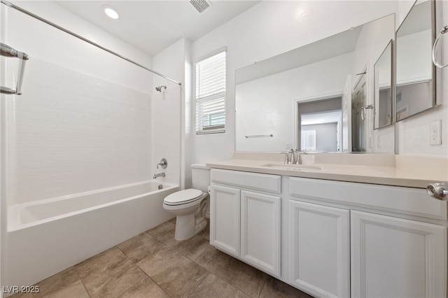 full bathroom with toilet, tiled shower / bath, and vanity