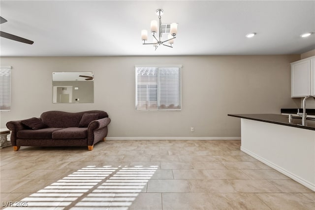 interior space featuring sink, light tile patterned flooring, and a chandelier