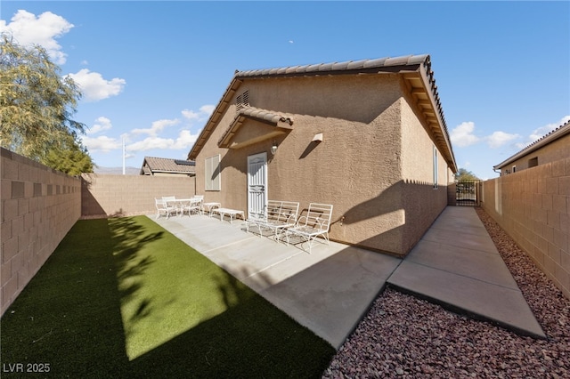 rear view of property with a patio