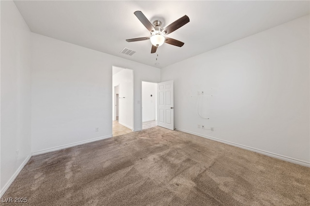 spare room with ceiling fan and carpet flooring