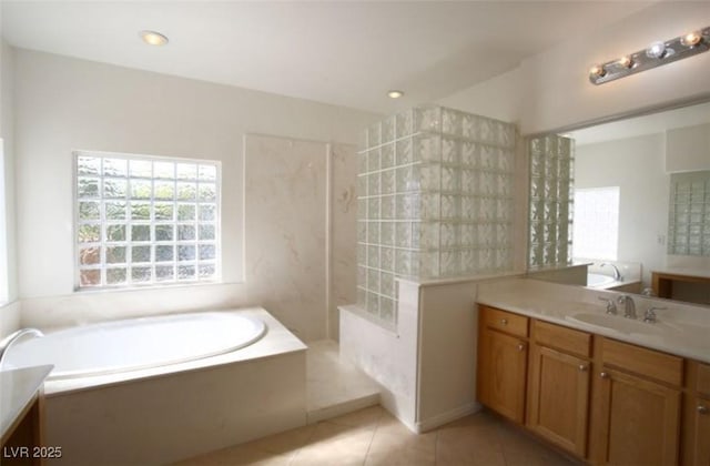 bathroom featuring separate shower and tub, tile patterned flooring, and vanity