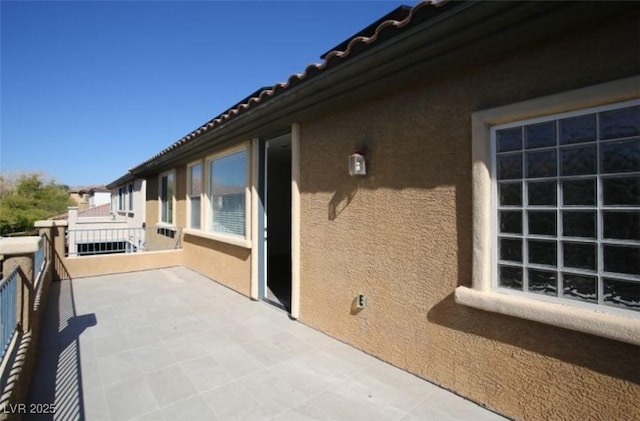 view of patio with a balcony