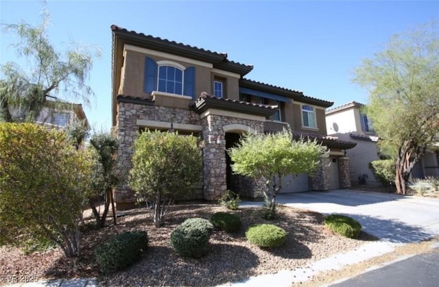 mediterranean / spanish-style home featuring a garage