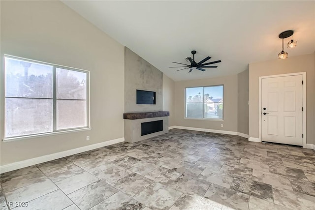 unfurnished living room featuring high vaulted ceiling, a large fireplace, and ceiling fan