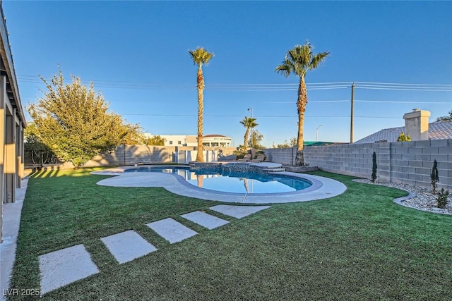 view of yard with a fenced in pool