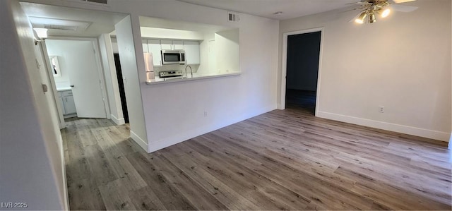 interior space featuring ceiling fan and light hardwood / wood-style floors