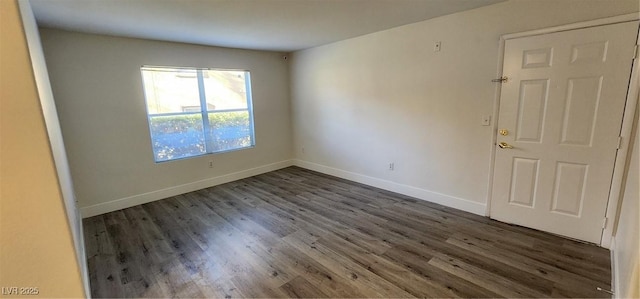 empty room with dark hardwood / wood-style floors