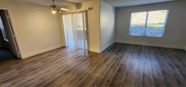 interior space with dark wood-type flooring, ceiling fan, and a healthy amount of sunlight