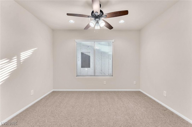 carpeted empty room with ceiling fan