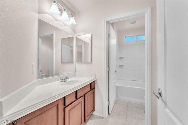 bathroom with bathing tub / shower combination, tile patterned floors, and vanity