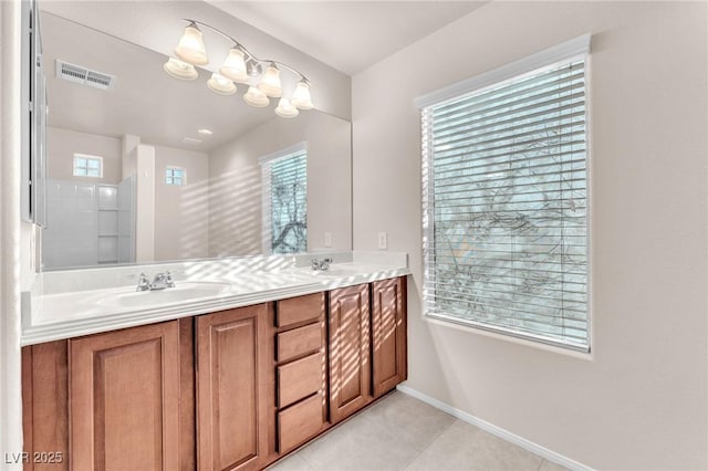 bathroom with tile patterned floors and vanity