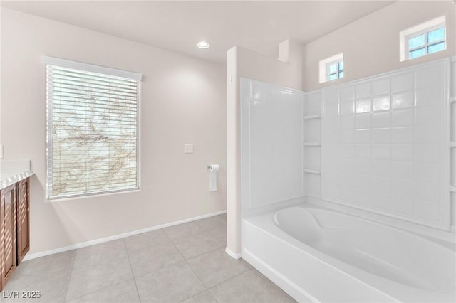 bathroom with tub / shower combination, vanity, and tile patterned flooring