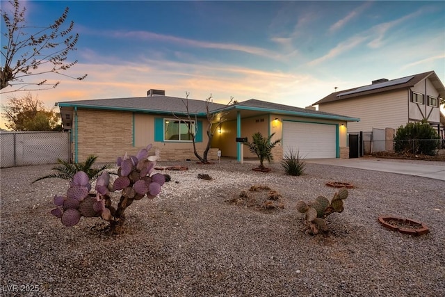 ranch-style home featuring a garage