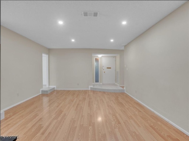 unfurnished living room featuring light wood-type flooring