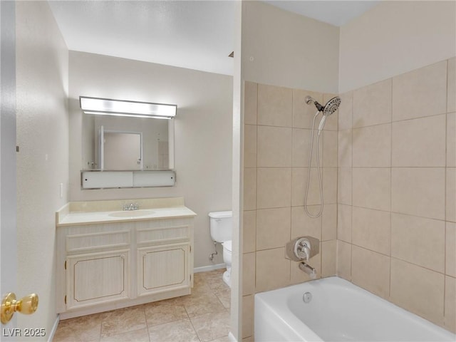 full bathroom featuring toilet, tile patterned flooring, tiled shower / bath, and vanity