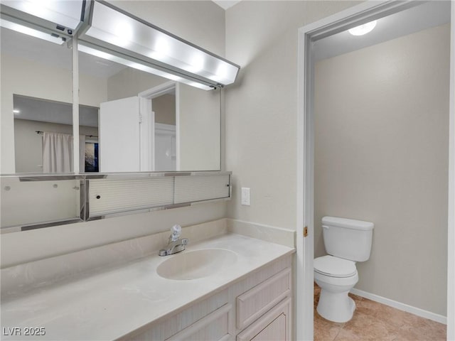 bathroom with toilet, tile patterned flooring, and vanity