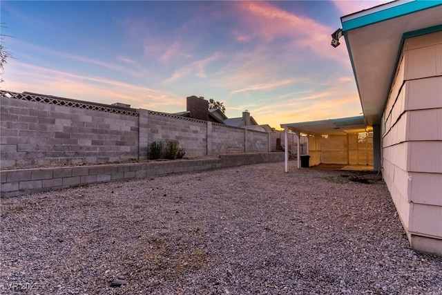 view of yard at dusk