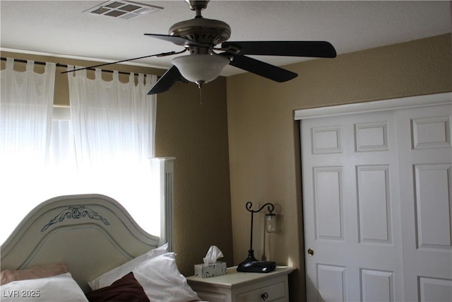 bedroom with a closet and ceiling fan