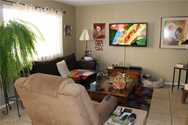 tiled living room featuring a healthy amount of sunlight