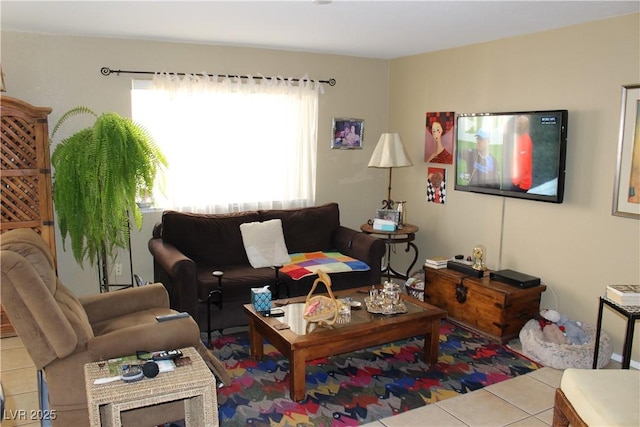 living room with light tile patterned flooring and plenty of natural light