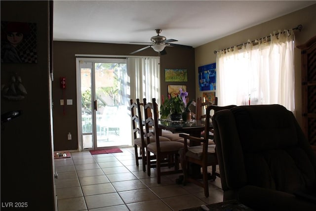 dining area with ceiling fan and light tile patterned floors