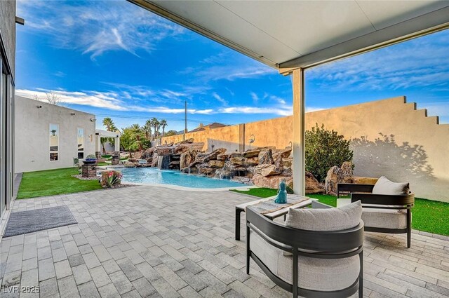 view of patio featuring pool water feature