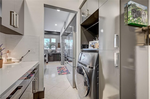 washroom featuring washer / dryer