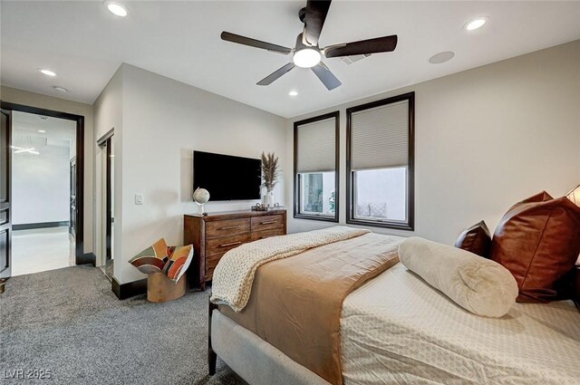 bedroom featuring ceiling fan and carpet