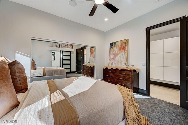 carpeted bedroom featuring a closet and ceiling fan