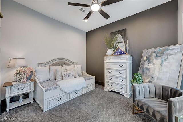 bedroom featuring dark carpet and ceiling fan