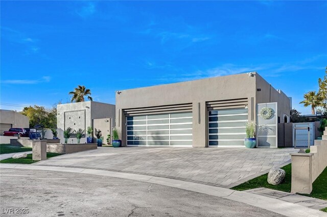 pueblo-style home with a garage