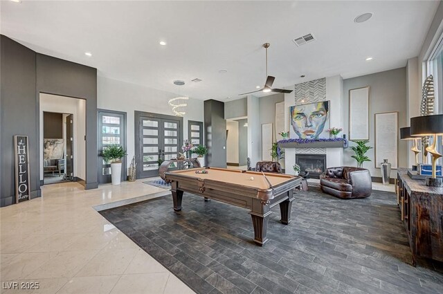 playroom with french doors, pool table, ceiling fan, and a fireplace