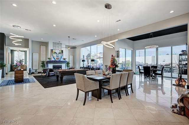 dining area featuring pool table and light tile patterned floors