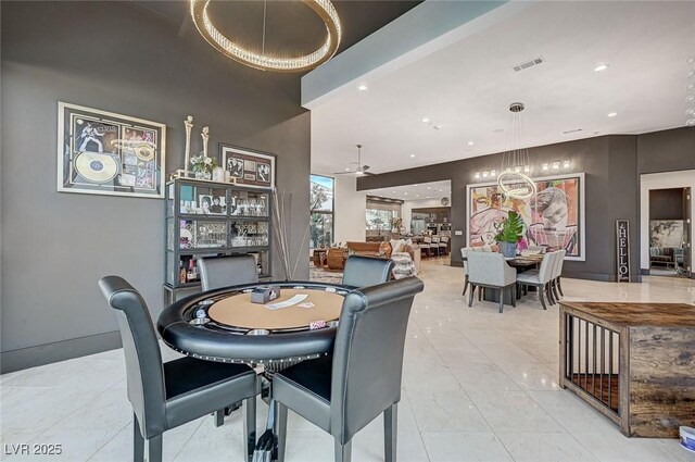 dining space with ceiling fan