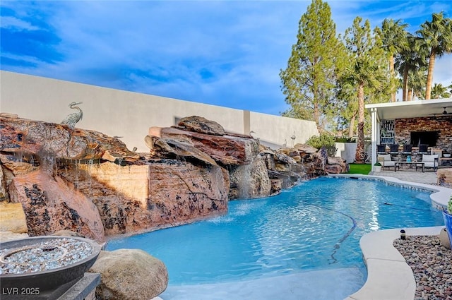 view of swimming pool featuring a patio area and pool water feature