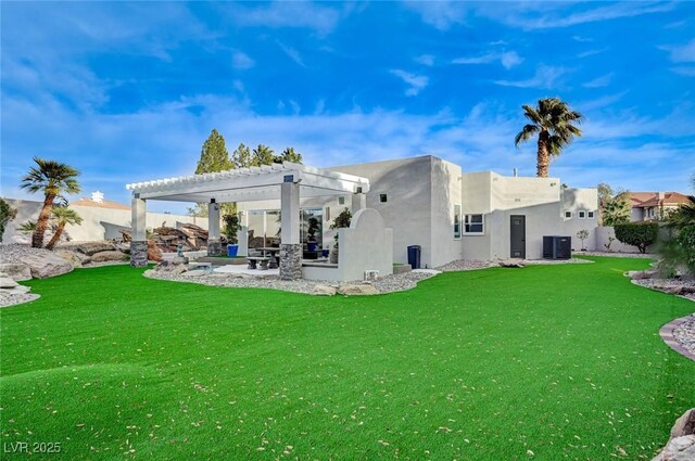 rear view of house with a patio, central AC unit, a yard, and a pergola