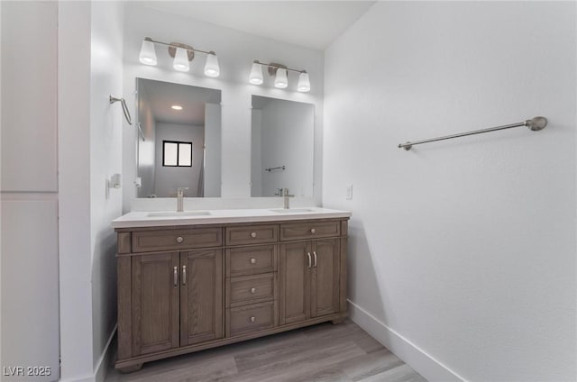 bathroom featuring hardwood / wood-style floors and vanity