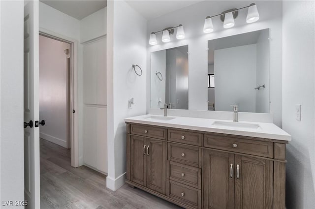 bathroom with vanity and hardwood / wood-style flooring