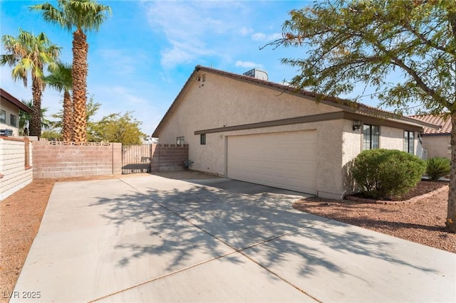 view of side of property featuring a garage